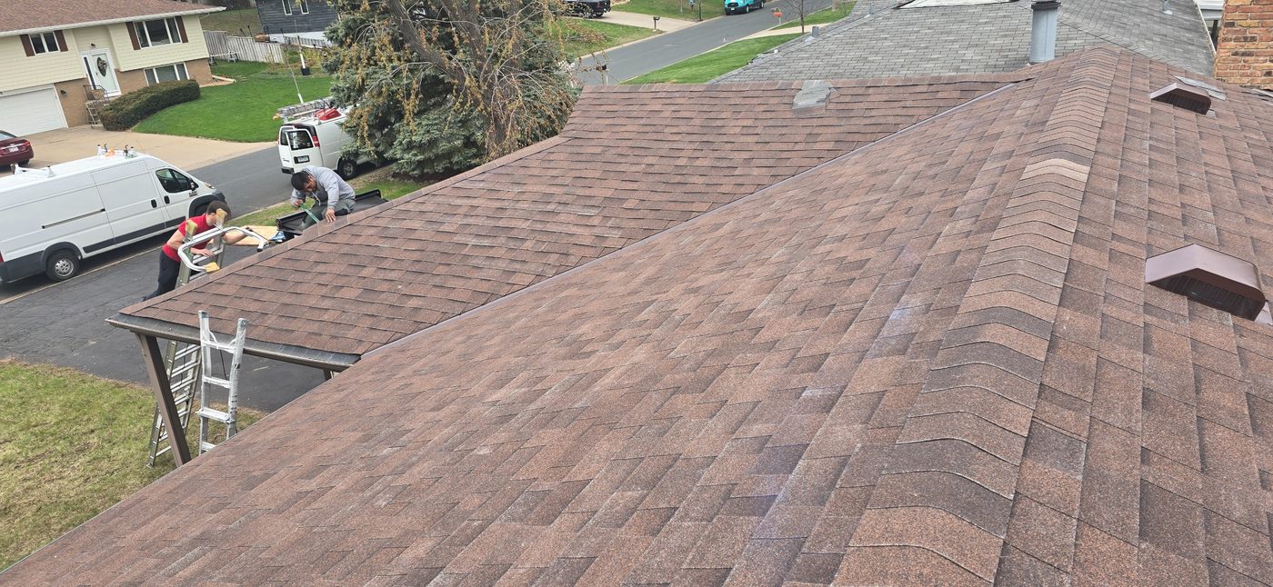 Sellers Roofing crew working on brown architectural shingles
