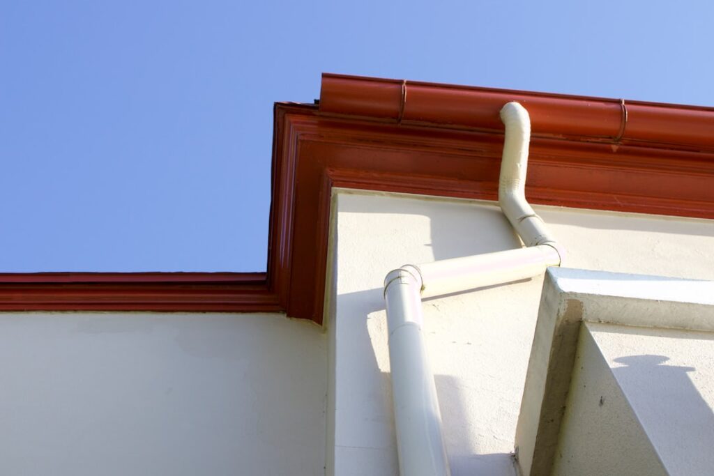 Gutter and downspout detail on the exterior of a building.